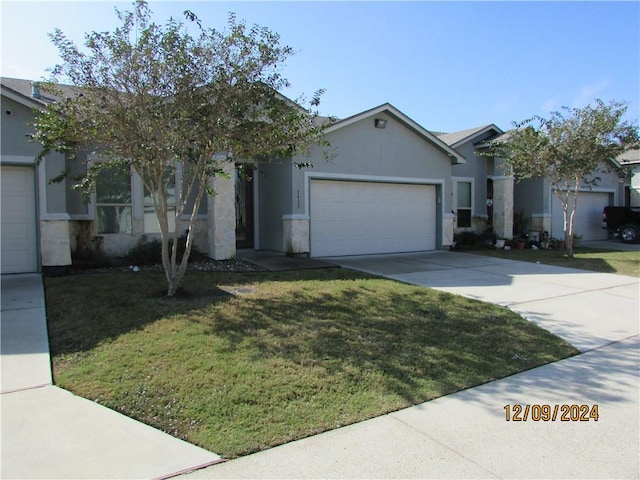 single story home with a front lawn and a garage