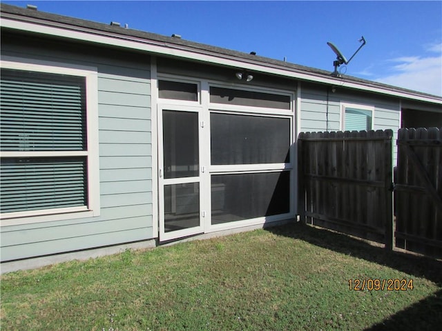 view of property exterior with a lawn