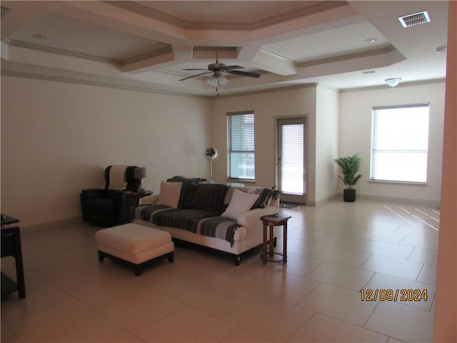 living room featuring ornamental molding, coffered ceiling, ceiling fan, light tile patterned floors, and beam ceiling