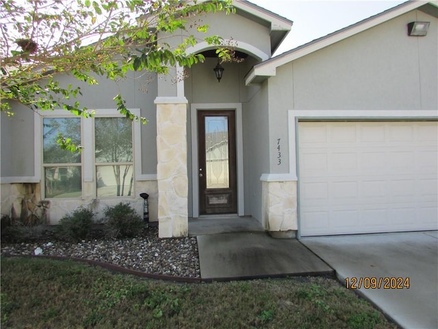 entrance to property featuring a garage