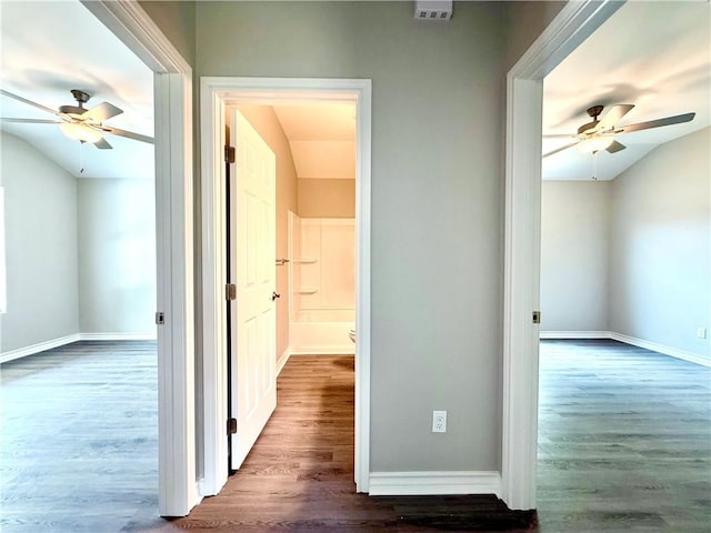 1108 N Staples St, Corpus Christi, TX 78401 - hallway featuring dark wood-type flooring, lofted ceiling, and baseboards