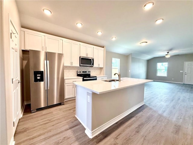 1108 N Staples St, Corpus Christi, TX 78401 - kitchen featuring stainless steel appliances, a sink, light wood finished floors, a ceiling fan, and recessed lighting