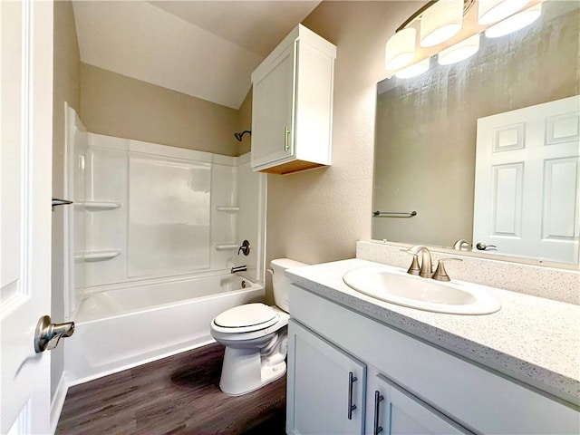 1108 N Staples St, Corpus Christi, TX 78401 - bathroom with wood finished floors, vanity, toilet, and bathtub / shower combination