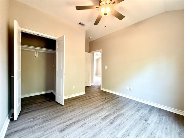 1108 N Staples St, Corpus Christi, TX 78401 - unfurnished bedroom featuring wood finished floors, baseboards, a closet, a ceiling fan, and lofted ceiling