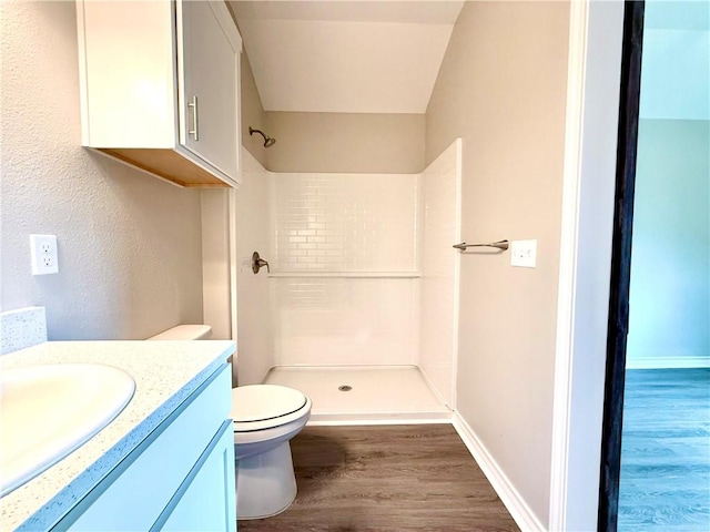 1108 N Staples St, Corpus Christi, TX 78401 - full bathroom with wood finished floors, a shower stall, vanity, toilet, and baseboards