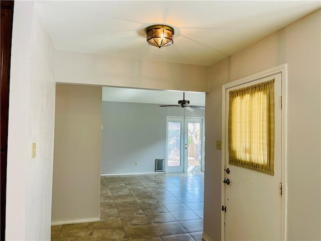 interior space featuring ceiling fan