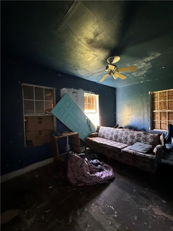 bedroom featuring a textured ceiling and a ceiling fan