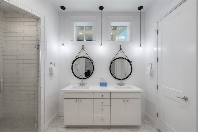 bathroom featuring vanity and a shower with door