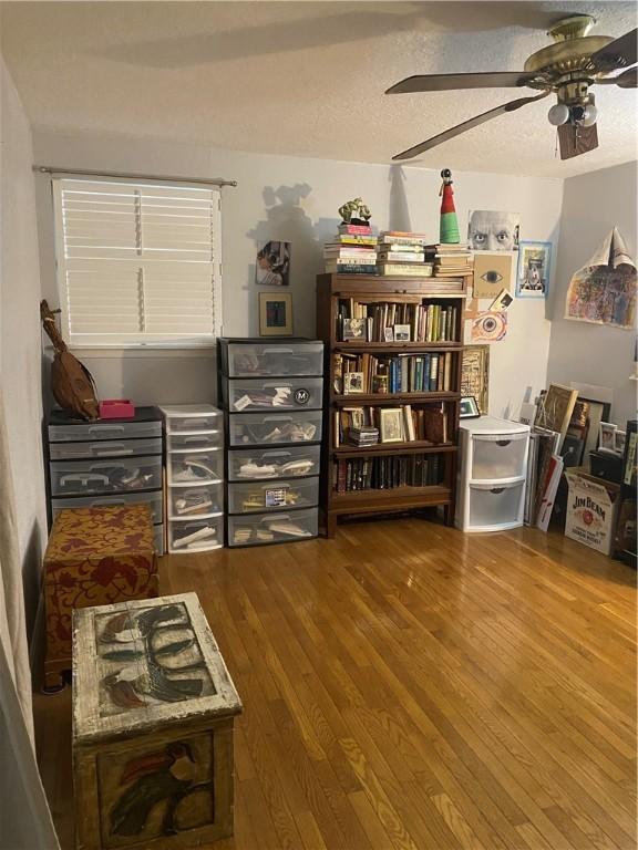 104 Park Pl, Portland, TX 78374 - sitting room with ceiling fan, wood finished floors, and a textured ceiling