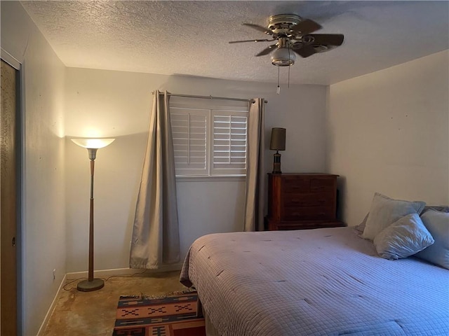 104 Park Pl, Portland, TX 78374 - bedroom featuring unfinished concrete floors, a textured ceiling, and a ceiling fan