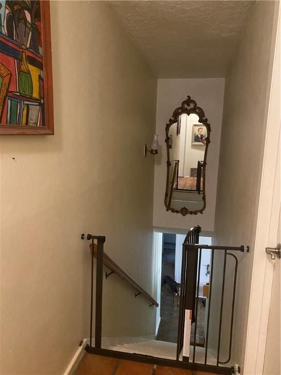 104 Park Pl, Portland, TX 78374 - staircase featuring a textured ceiling and baseboards