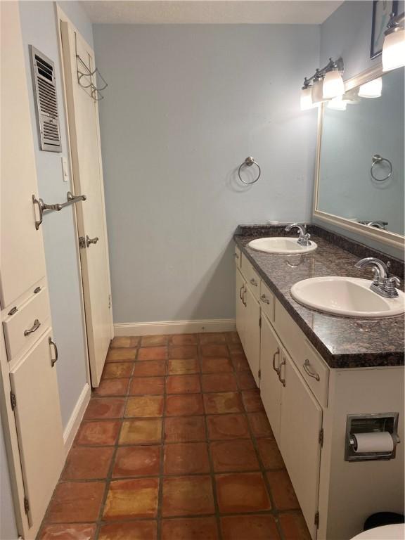 104 Park Pl, Portland, TX 78374 - bathroom with double vanity and tile patterned flooring