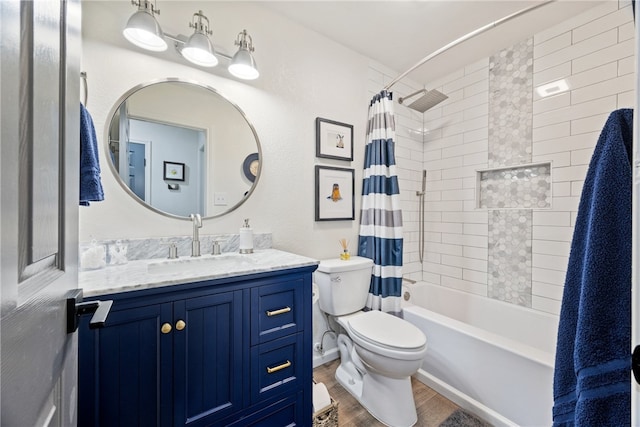 bathroom with vanity, wood finished floors, toilet, and shower / tub combo with curtain