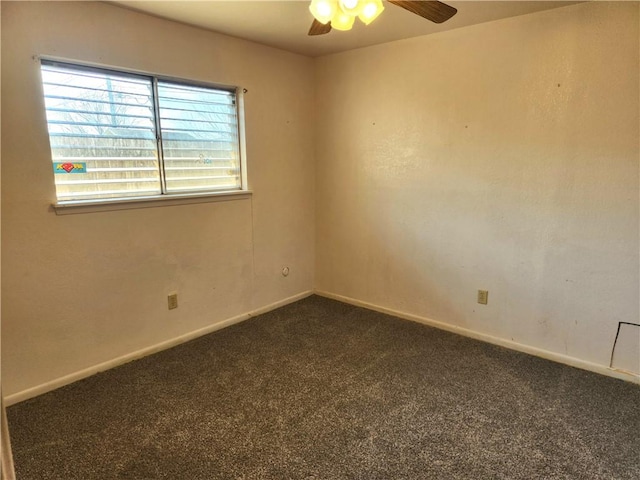 unfurnished room featuring ceiling fan and dark colored carpet