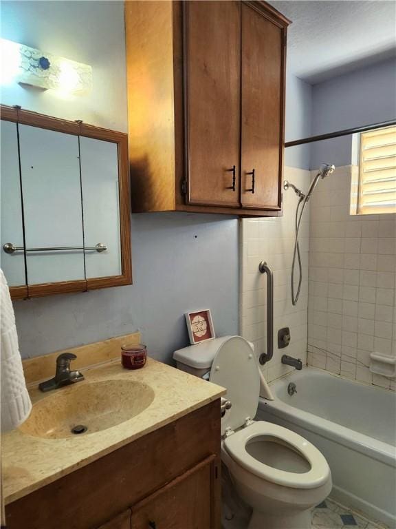 full bathroom with vanity, toilet, and tiled shower / bath