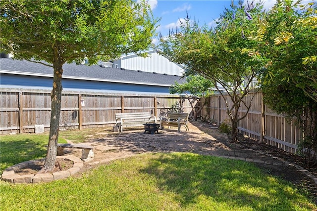 2342 Vaughan Dr, Corpus Christi, TX 78414 - fenced backyard with a fire pit