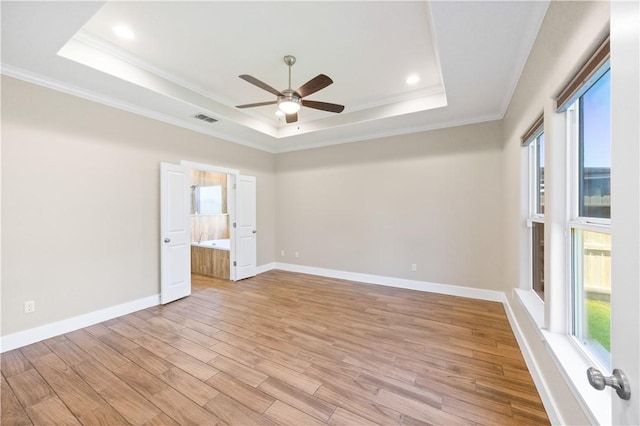 2342 Vaughan Dr, Corpus Christi, TX 78414 - empty room featuring a raised ceiling, ornamental molding, a ceiling fan, light wood-style flooring, and recessed lighting