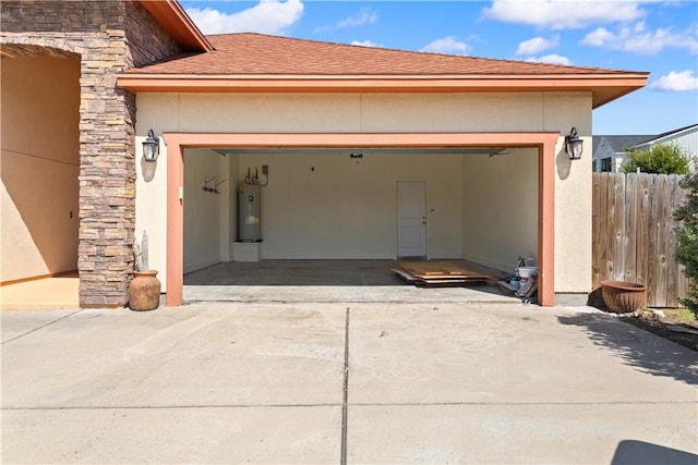 2342 Vaughan Dr, Corpus Christi, TX 78414 - garage with electric water heater and concrete driveway