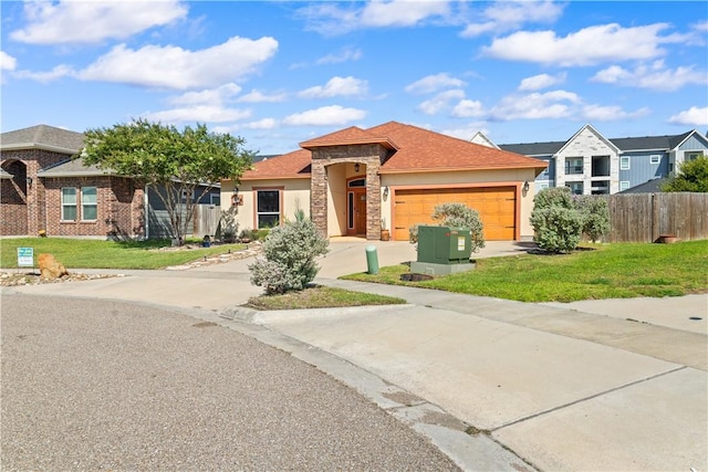 2342 Vaughan Dr, Corpus Christi, TX 78414 - view of front of house featuring a garage, concrete driveway, stone siding, and stucco siding
