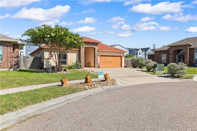 2342 Vaughan Dr, Corpus Christi, TX 78414 - view of front of home featuring an attached garage, concrete driveway, and a residential view
