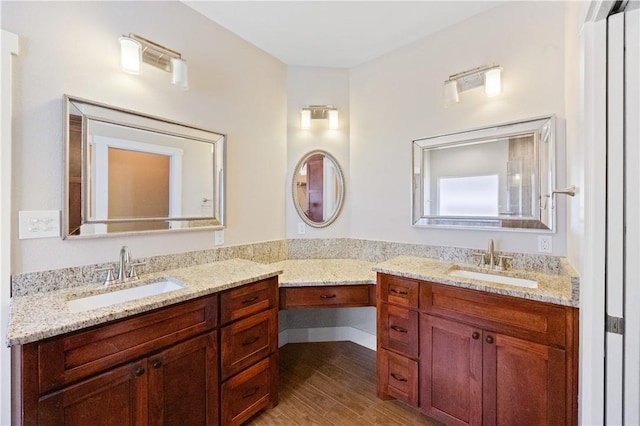 2342 Vaughan Dr, Corpus Christi, TX 78414 - full bathroom with two vanities and wood finished floors