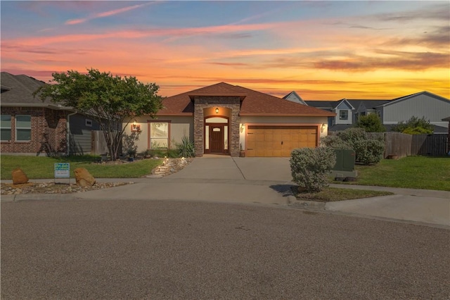 2342 Vaughan Dr, Corpus Christi, TX 78414 - view of front of home with a garage, concrete driveway, and stone siding
