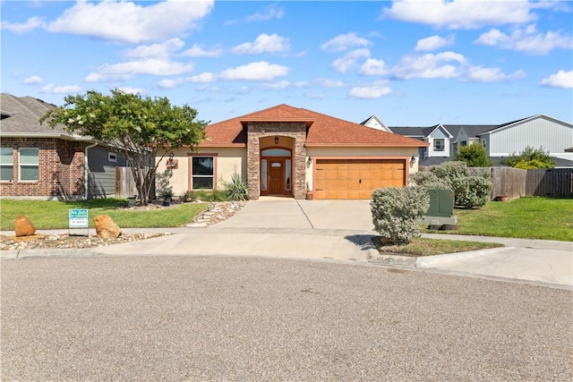 2342 Vaughan Dr, Corpus Christi, TX 78414 - mediterranean / spanish-style home with an attached garage, driveway, stone siding, and stucco siding
