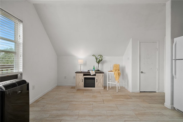 interior space featuring plenty of natural light and lofted ceiling