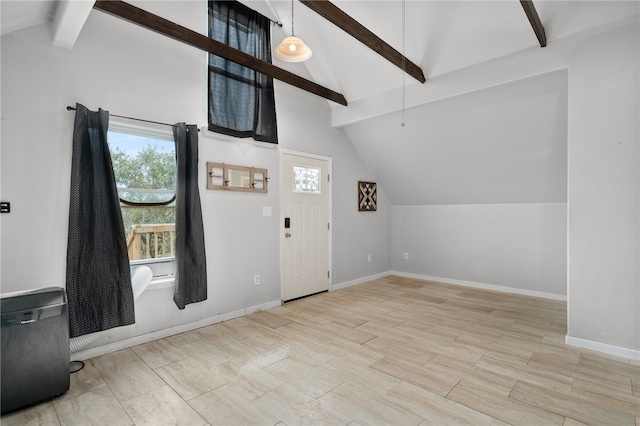 entrance foyer with lofted ceiling with beams