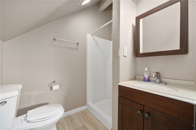 bathroom featuring toilet, a shower, vanity, and lofted ceiling