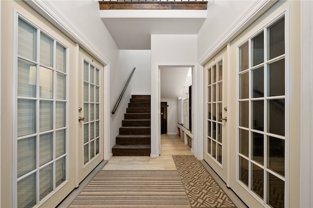 interior space featuring french doors, beamed ceiling, and tile patterned floors