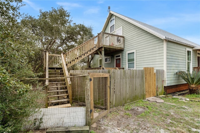 view of home's exterior featuring a deck