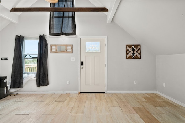 entrance foyer featuring light hardwood / wood-style floors and vaulted ceiling with beams