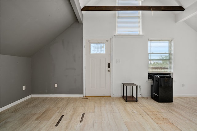 foyer entrance featuring light hardwood / wood-style floors, beamed ceiling, and high vaulted ceiling