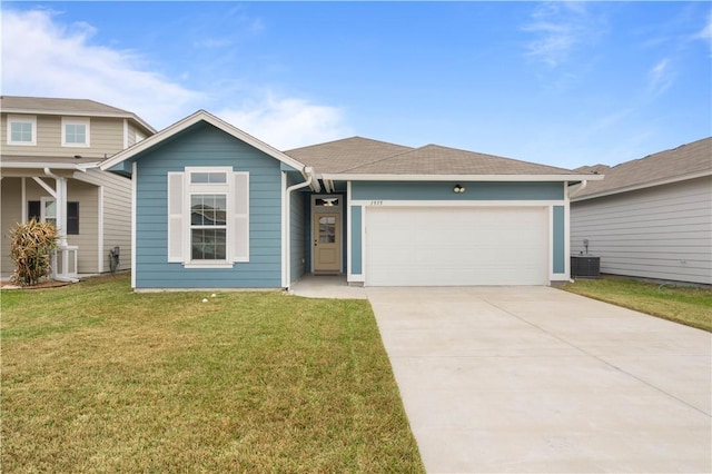 ranch-style home with an attached garage, central air condition unit, driveway, roof with shingles, and a front yard