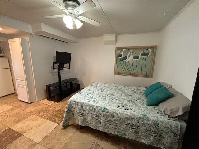 bedroom featuring white fridge and ceiling fan