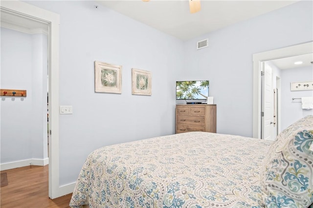 bedroom with ceiling fan and light wood-type flooring