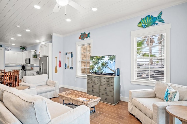 living room with crown molding, ceiling fan, wood ceiling, and light wood-type flooring