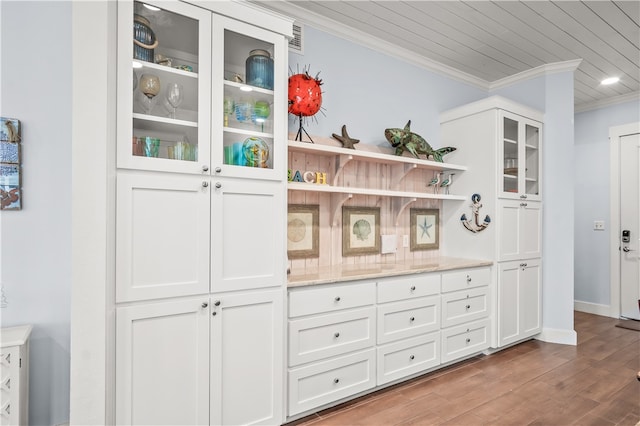 interior space with crown molding, wood-type flooring, and wood ceiling