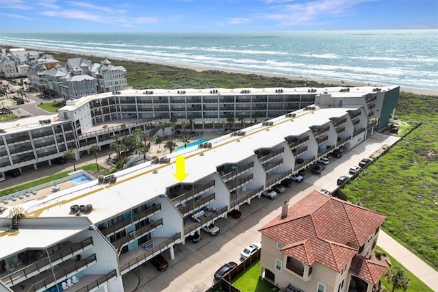 drone / aerial view with a water view and a view of the beach