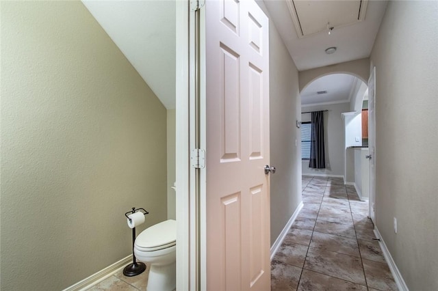 2526 Whirlwind St, Corpus Christi, TX 78414 - hallway featuring arched walkways and attic access