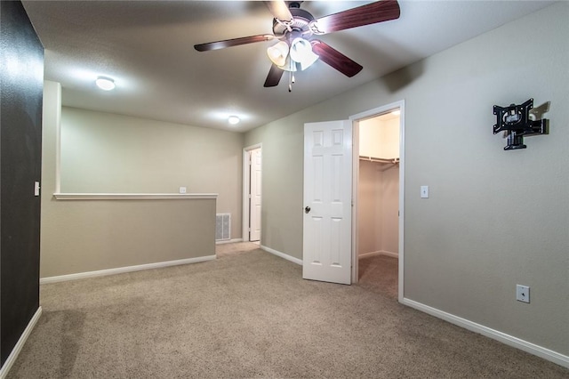 2526 Whirlwind St, Corpus Christi, TX 78414 - unfurnished bedroom with a walk in closet, carpet, ceiling fan, and a closet