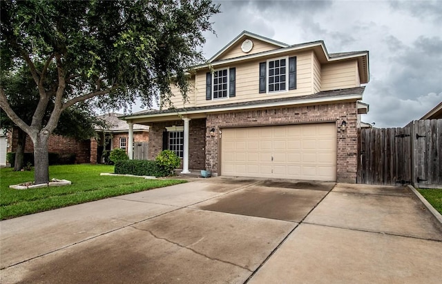 2526 Whirlwind St, Corpus Christi, TX 78414 - traditional-style house with brick siding, an attached garage, and driveway