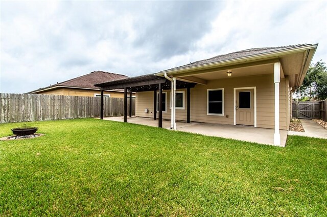 2526 Whirlwind St, Corpus Christi, TX 78414 - back of property featuring a fire pit, a patio area, a fenced backyard, and a pergola