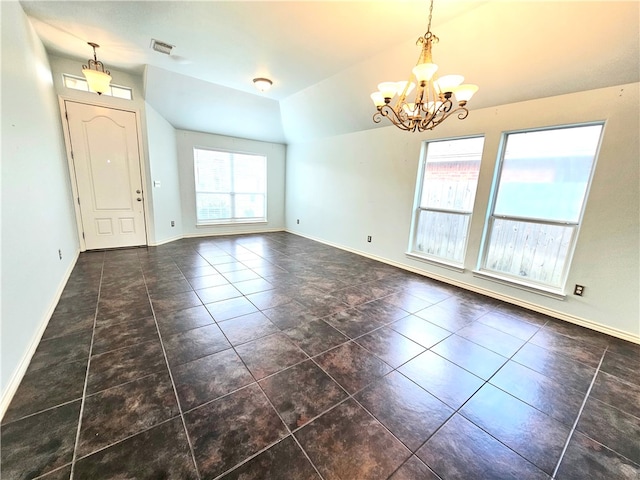 tiled spare room with lofted ceiling, a notable chandelier, and a healthy amount of sunlight