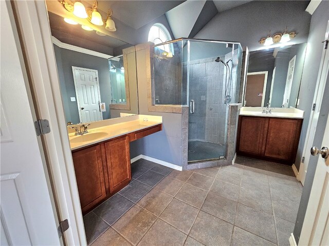 bathroom with vanity, tile patterned floors, and a shower with door