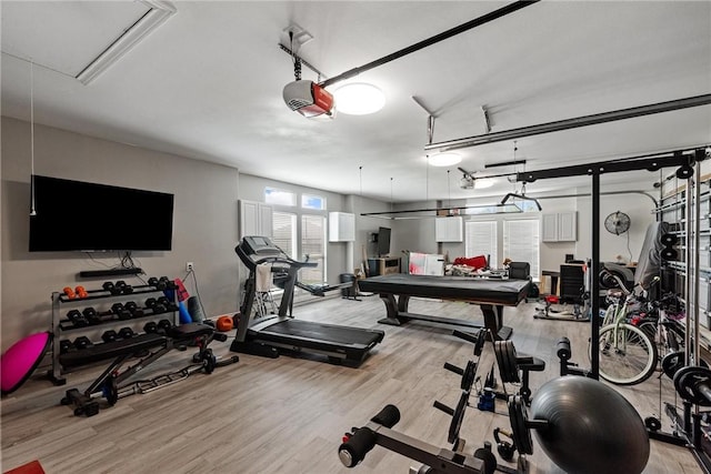 6406 Legacy Pt, Corpus Christi, TX 78414 - gym featuring a garage, attic access, and light wood-style flooring