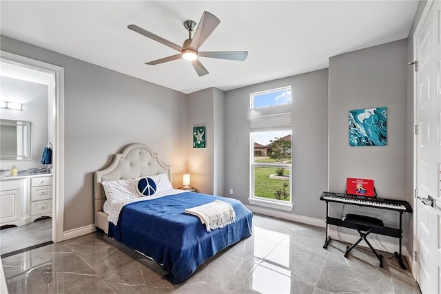 6406 Legacy Pt, Corpus Christi, TX 78414 - bedroom with baseboards, a ceiling fan, connected bathroom, and marble finish floor
