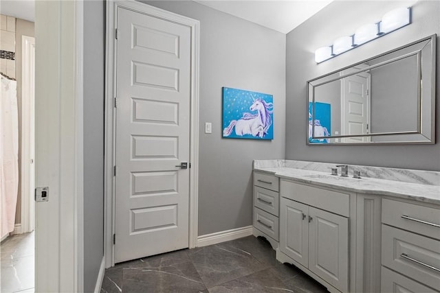 6406 Legacy Pt, Corpus Christi, TX 78414 - bathroom featuring baseboards, a shower with shower curtain, marble finish floor, and vanity