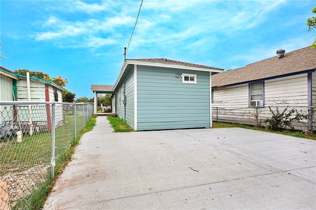 view of home's exterior with cooling unit